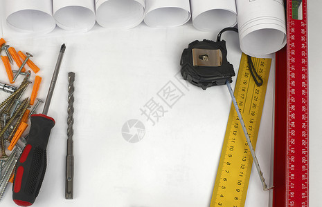 建筑图画和工具的卷轴绘画销钉线条蓝图塑料螺丝刀桌面项目螺栓文档背景图片