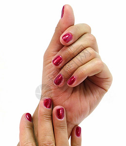 妇女亲手白色皮肤身体手指指甲美容师女性手臂红色温泉背景图片