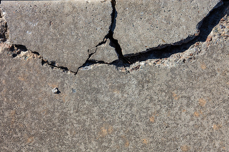 碎裂的混凝土表面裂痕石墙缺陷材料风化裂缝建筑石头缺口接缝背景图片