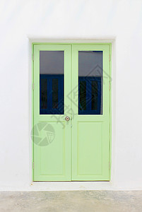 扇门锁孔入口家具房子绿色网关框架白色木板木头背景图片