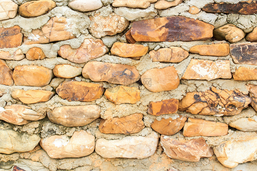 石墙建筑学灰色棕色石头材料岩石栅栏安全黄色圆形图片