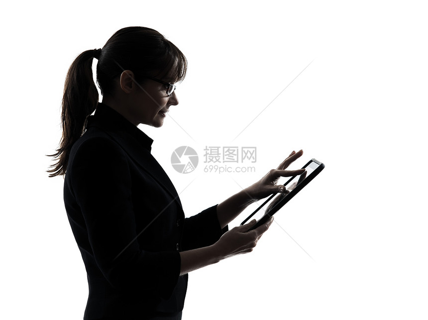 商业妇女计算机计算打数字平板电脑Silhoue图片