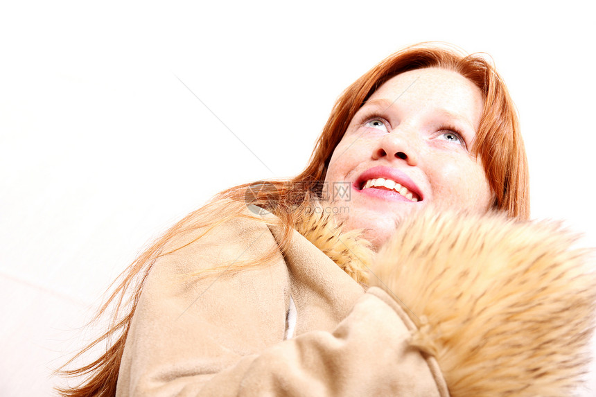 穿冬装的女人头发微笑外套女士喜悦眼睛季节夹克化妆品牙齿图片