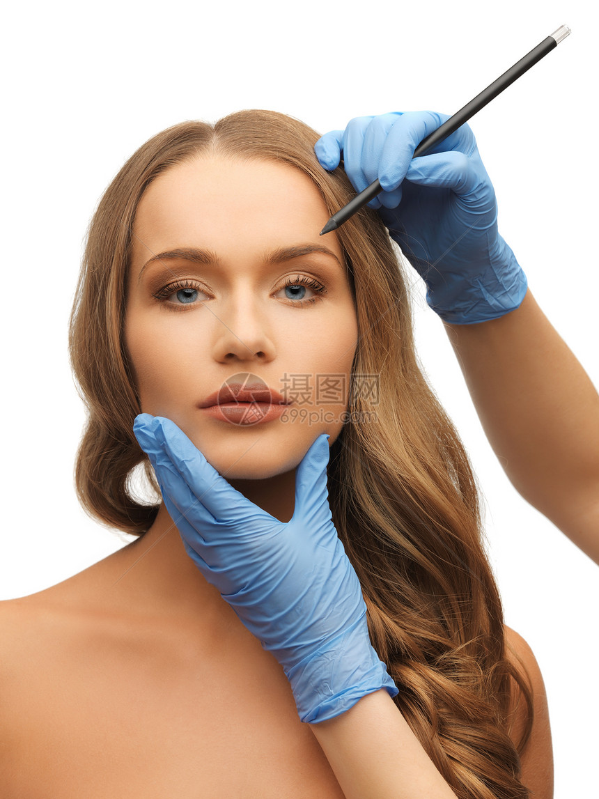 妇女的脸部和美容的手临床老化程序蓝色诊所化妆品绘画成人病人手术图片