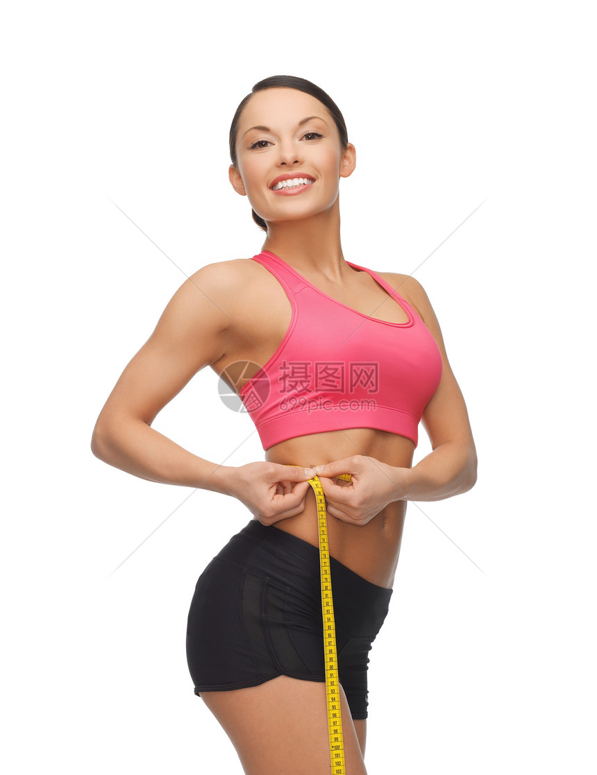 带有测量胶带的运动妇女磁带损失健康身体饮食教练腹部微笑训练女孩图片