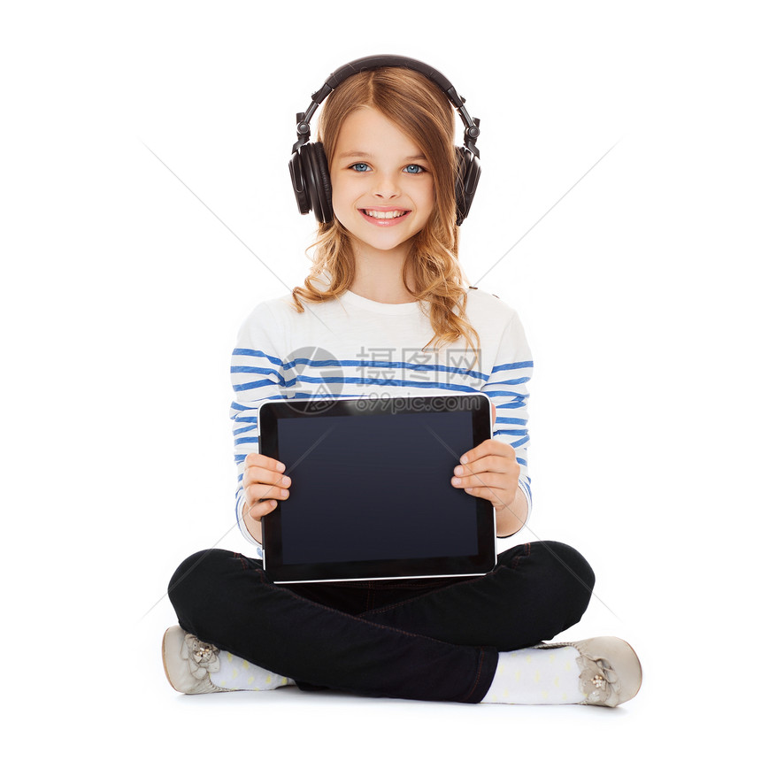 有显示平板电脑 pc 的耳机的孩子图片