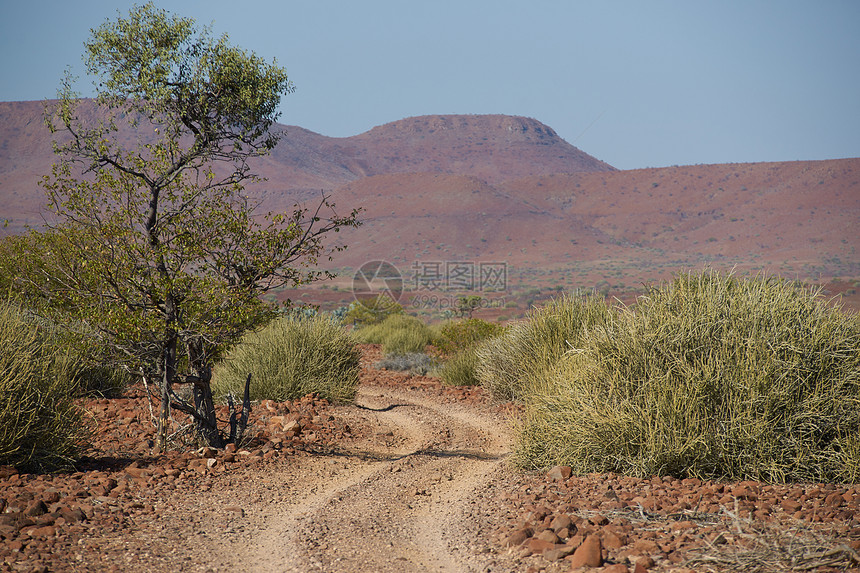 石块路红色衬套火山天空植被干旱沙漠蓝色荒野图片