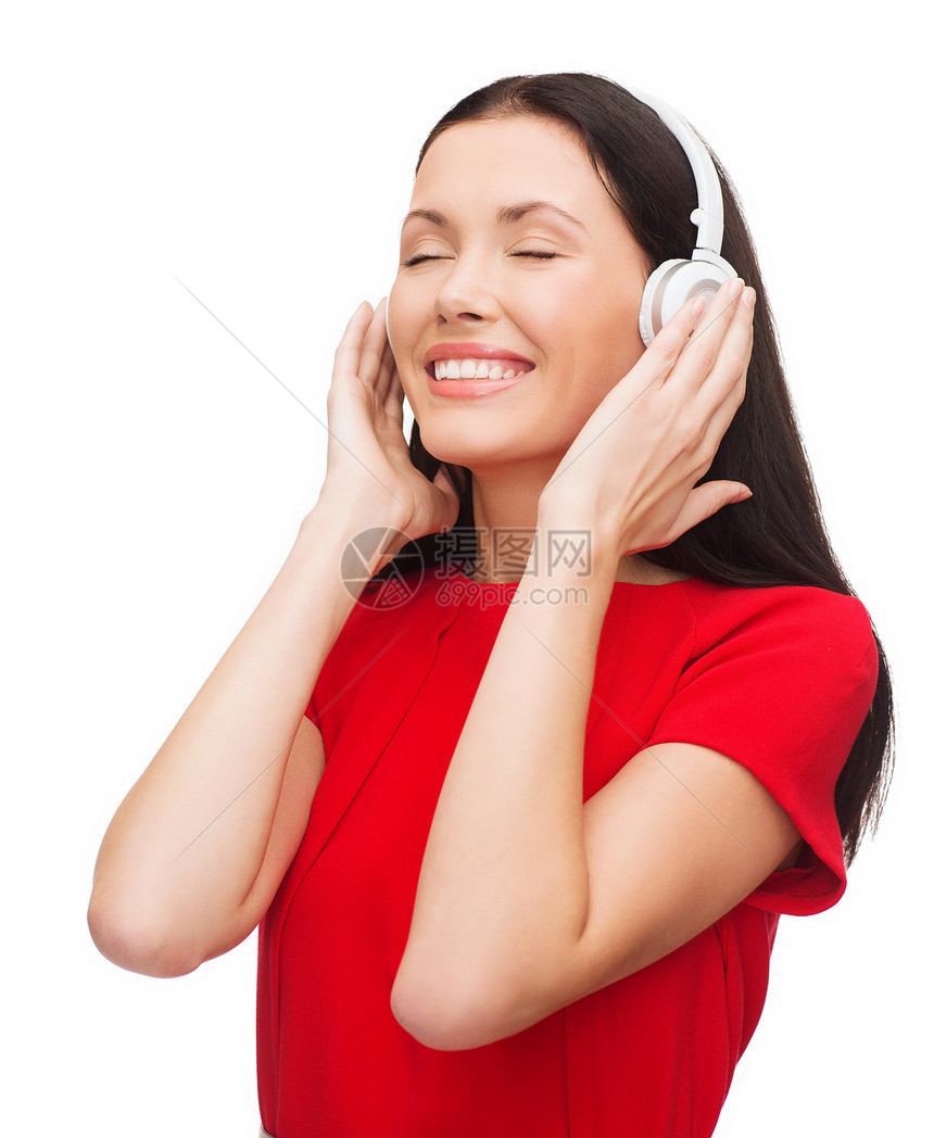 带着耳机的微笑着的妇女歌曲享受娱乐快乐闲暇手机女孩播客音乐打碟机图片