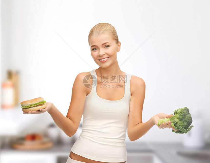 带西兰花和汉堡包的笑着女人房间损失困境饮食微笑生物食物减肥数字维生素图片