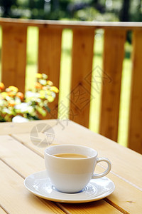 咖啡杯泡沫刀具杯子热饮花园咖啡牛奶享受桌子棕色背景图片
