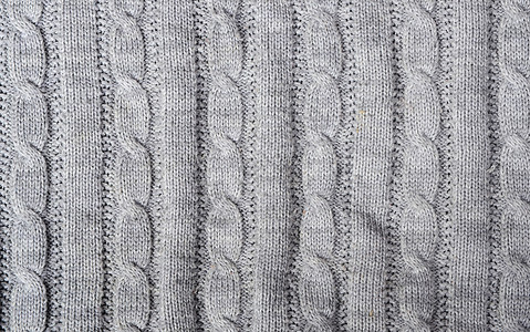 毛衣细节电缆线条纺织品白色灰色背景图片