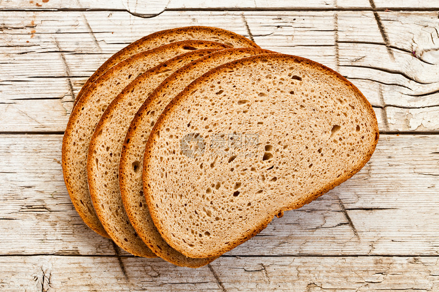 五片黑麦面包营养食物种子宏观乡村亚麻燕麦小麦背景美食图片