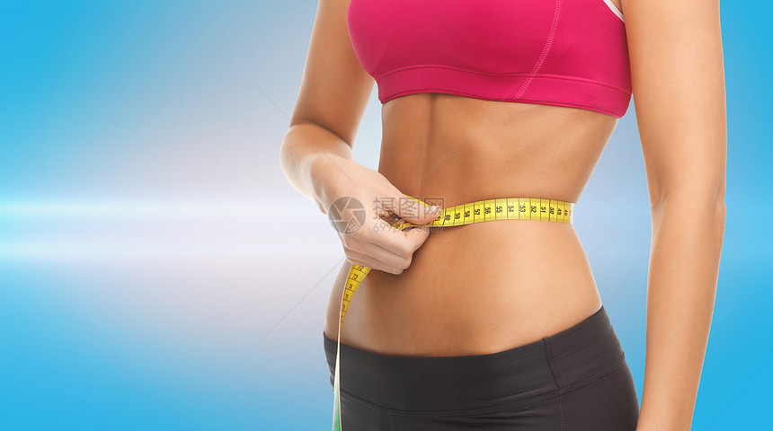 精练的腹部和测量胶带训练数字健身房蓝色减肥腰部女孩健康激光身体图片