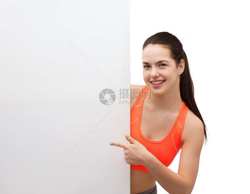 与白板穿运动服的少女饮食手指木板女性减肥运动装损失微笑女孩身体图片