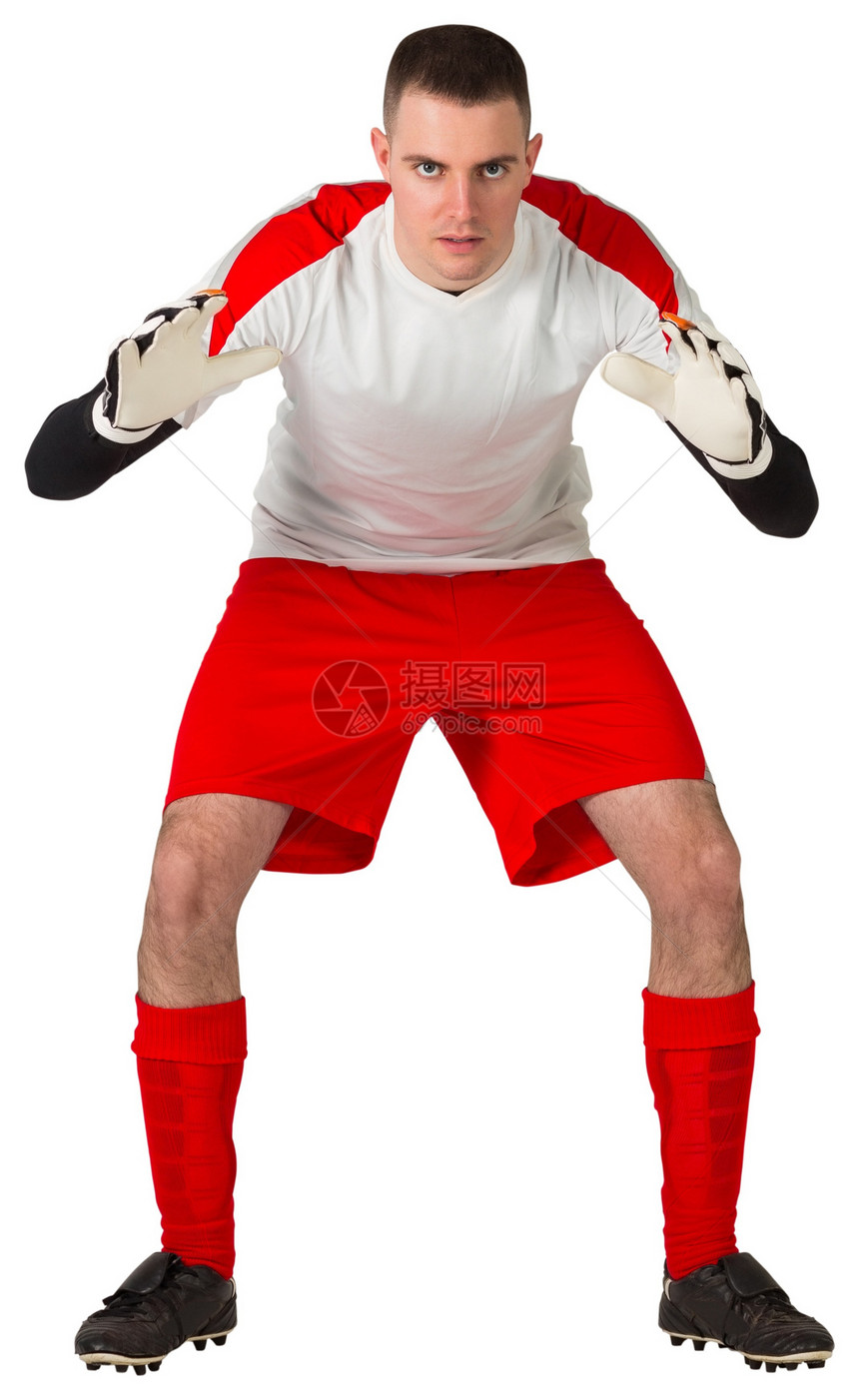 红白的守门员准备接球专注男性齿轮播放器运动服白色男人活动红色运动员图片