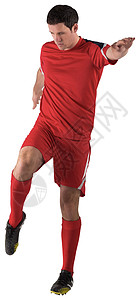 红脚踢足球运动员运动活动男性男人播放器齿轮红色运动服背景图片