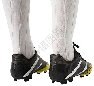 紧贴足球靴运动运动员白色齿轮活动运动服足球靴播放器黑色背景图片