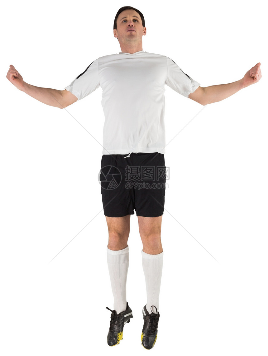 白跳跃中的足球运动员黑色齿轮男人活动白色运动运动服播放器男性图片