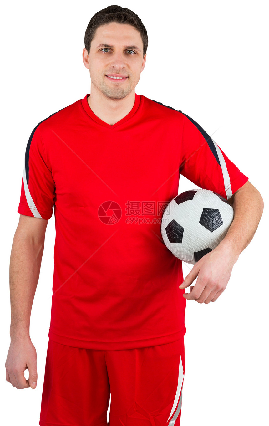 英俊的足球运动员在看摄影机齿轮微笑男人播放器运动服运动红色男性活动快乐图片