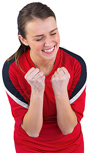 红欢呼的足球球迷兴奋欣快感优胜者红色快乐运动球衣支持者欢呼杯子扇子背景图片