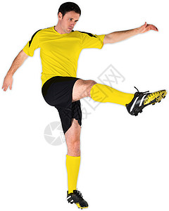黄色脚踢足球运动员男人运动服播放器运动男性齿轮活动背景图片