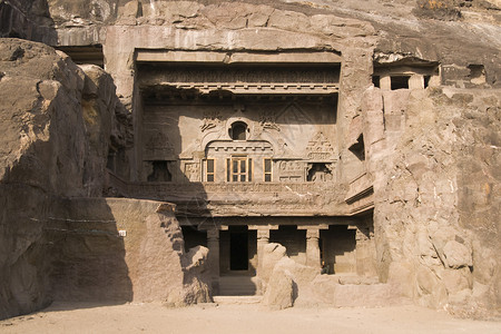 佛教洞穴寺庙建筑历史性宗教遗产大厅悬崖雕刻工匠岩石精神背景图片
