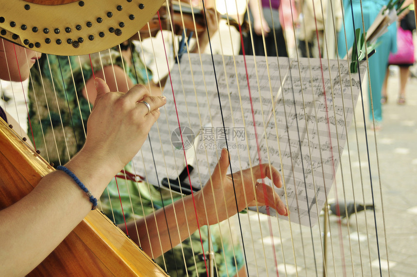 竖琴播放器玩家女士歌曲乐队音乐家音乐字符串手指图片