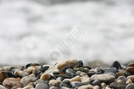 石头地质学海滩泡沫波浪灰色鹅卵石背景图片