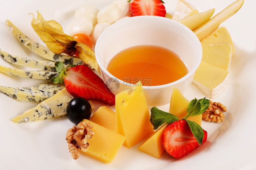 配蜂蜜的各类奶酪熟食盘子食物蜂蜜小吃早餐美食奶制品蓝色干酪图片