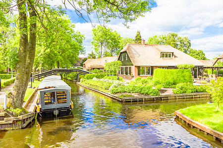 圩田荷兰吉埃索恩典型的荷兰住宅和菜园Giethoorn花园旅游旅行溪流假期文化场景茅草房子小屋背景