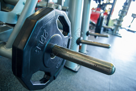 平板和重量板医疗训练吧台健身房重量保健金属举重医学背景图片