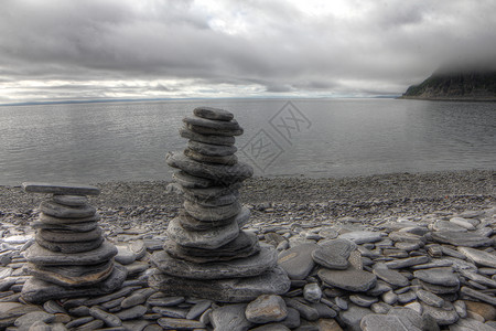 牛首胜境首湾背景的石头堆岩石海岸艺术海滩平衡峡湾天空雕塑冥想海洋背景