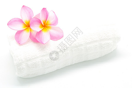 粉色带毛巾的柏油白色香味异国花朵温泉花瓣情调热带背景图片