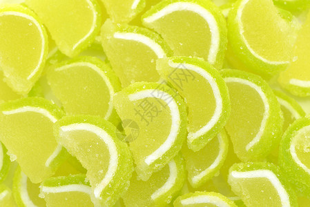 柠檬切片宏观绿色糖果甜点酸橙背景图片