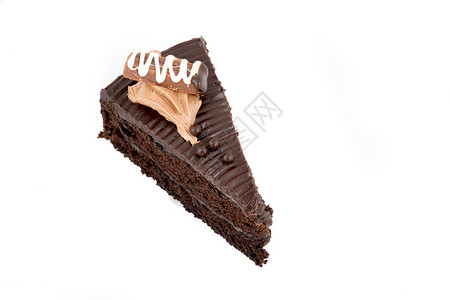 巧克力蛋糕 上面有慕斯美食白色奶油食物盘子甜点巧克力蛋糕磨砂棕色背景图片