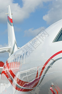 公司喷气式飞机详情红色商业白色航空蓝色旅行运输背景图片