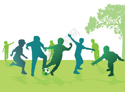 男孩踢足球草地孩子们足球场运动后人男孩们青年团队公园后代背景图片