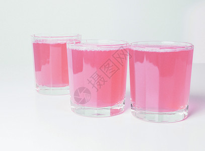 粉红葡萄果汁眼镜水果酒吧西柚汁天堂早餐酒店葡萄柚玻璃红色背景图片