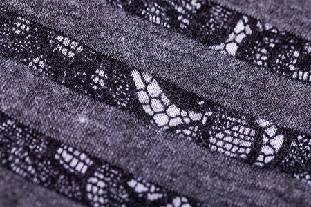 特写灰色松银线服装装饰针线活奢华纺织品折叠缝纫衣服材料褶皱背景图片
