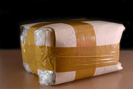 塑料胶带简便包装信使邮件货物服务塑料纸板发送船运盒子运输背景