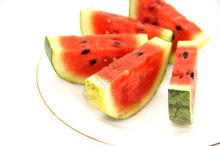 切片西瓜在盘子上 被白背景隔离白色种子部门水果蔬菜背景图片