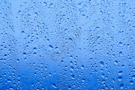 水滴宏观雨滴液体天气玻璃背景图片