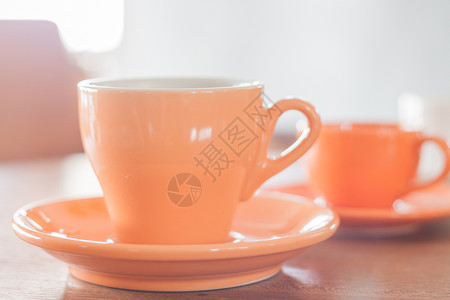 橙色咖啡杯和迷你橙色咖啡杯背景图片