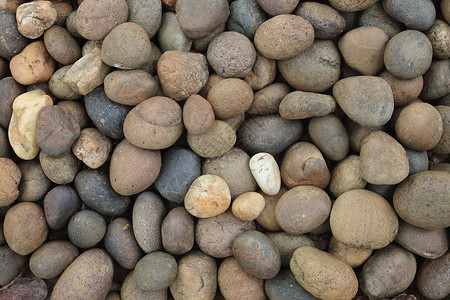 颗粒石椭圆形岩石鹅卵石地面圆圈矿物石头卵石圆形背景图片