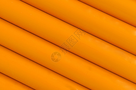 橙色塑料管状结构图案背景管道团体管子排水沟背景图片