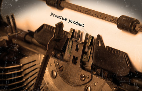 有纸张的旧打字机金属产品棕褐色黑色键盘按钮钥匙空白白色文档背景图片