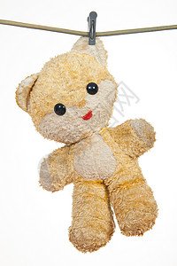泰迪熊挂在一根绳子上背景图片