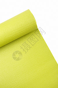 绿色运动垫健康健身橡皮螺旋瑜伽对象肋骨纹理运动影棚背景图片