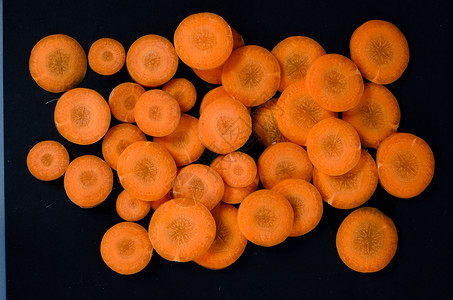 胡萝卜圆形绿色黑色饮食橙子食物蔬菜背景图片