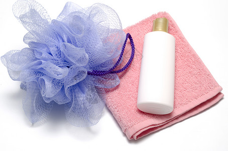 泡泡浴液肥皂和毛巾治疗洗发水化妆品淋浴绳索温泉蓝色产品浴缸塑料背景